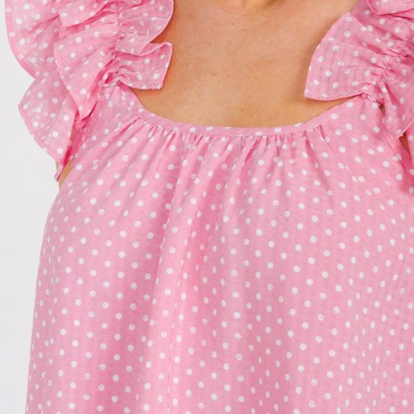 Ruffle polka dots tank top with sleeveless design and feminine neckline detailing.