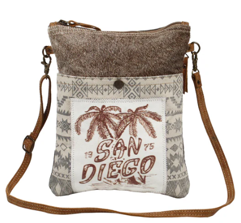 MYRA-San Diego Print small cross-body bag with canvas, leather, and hairon material.