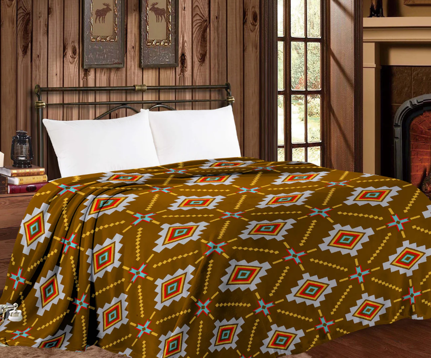 Mia Throw Blanket in brown Aztec design on queen size bed.