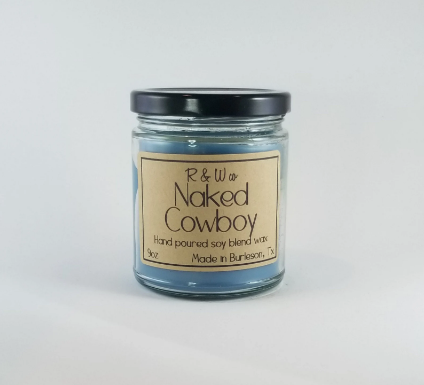R&W Co. Naked Cowboy scented candle with soy blend wax in a glass jar.