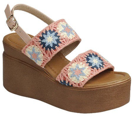 Wedge high heel sandal in vibrant pink with floral design.