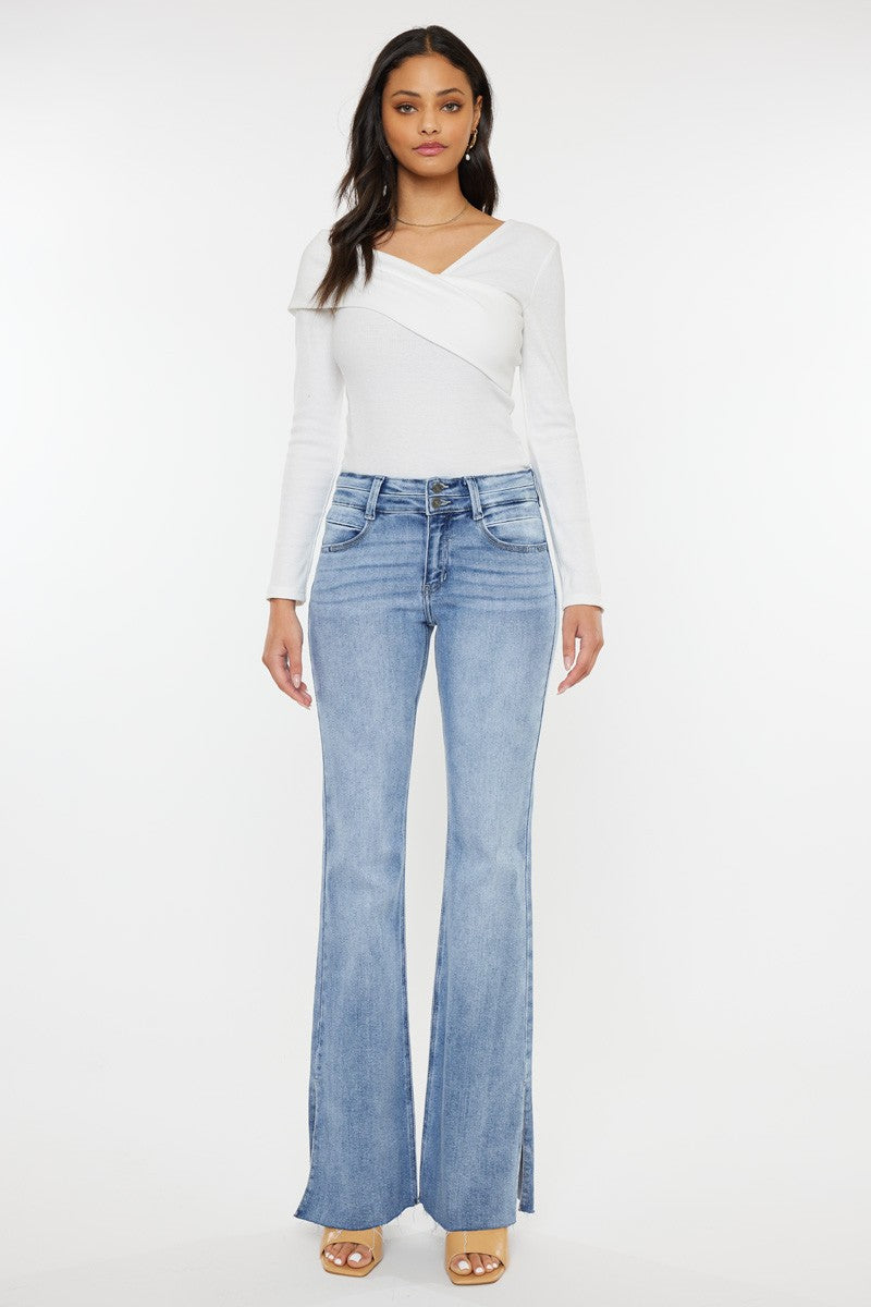 Kan Can Selena mid rise flare jeans with double waistband in light wash featuring side slit detail.