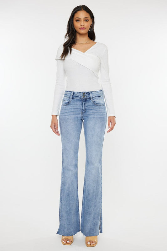 Kan Can Selena mid rise flare jeans with double waistband in light wash featuring side slit detail.