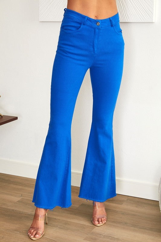 High Rise Flare Jeans with raw hem in blue.
