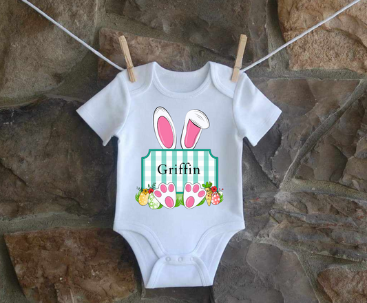 Personalized Easter Bunny infant shirt hanging on clothesline.