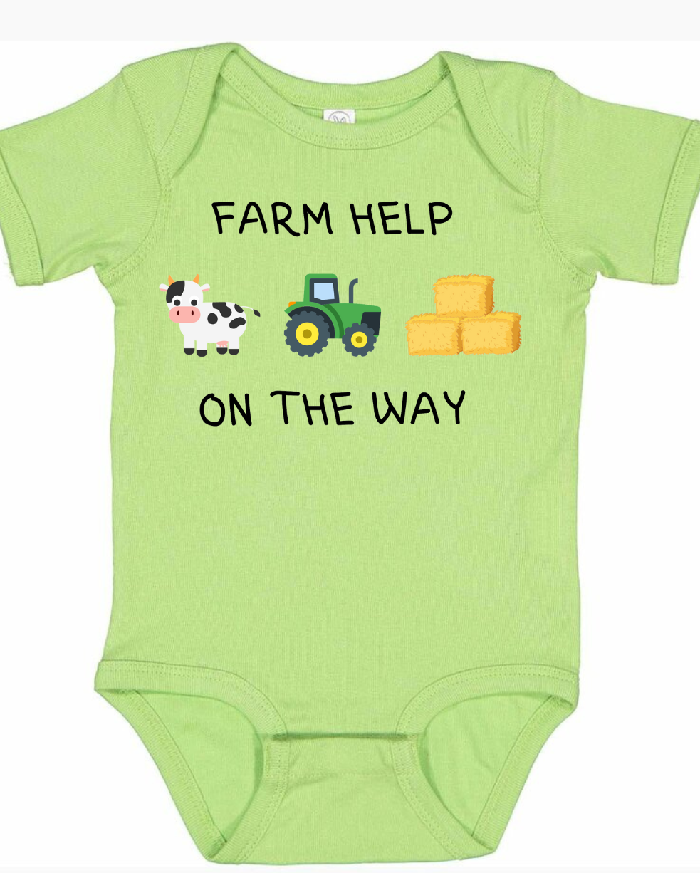 Green infant and toddler shirt with farm theme design featuring a cow, tractor, and hay bales.