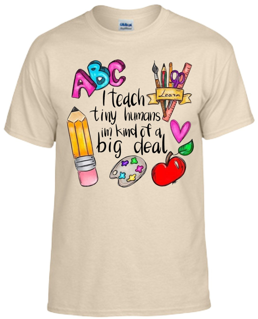 Shirt with "I Teach Tiny Humans I'm Kind of a Big Deal" design featuring colorful school-themed graphics.