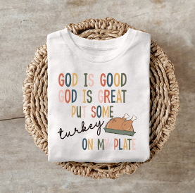 Thanksgiving shirt with "God is Good, God is Great, Put Some Turkey on My Plate" design in fall colors.