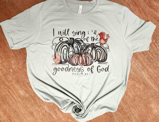 Shirt with "I Will Sing of The Goodness of God" text and fall pumpkin design.