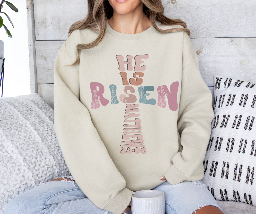 He Is Risen sweatshirt with bold colorful design, celebrating Easter and faith.