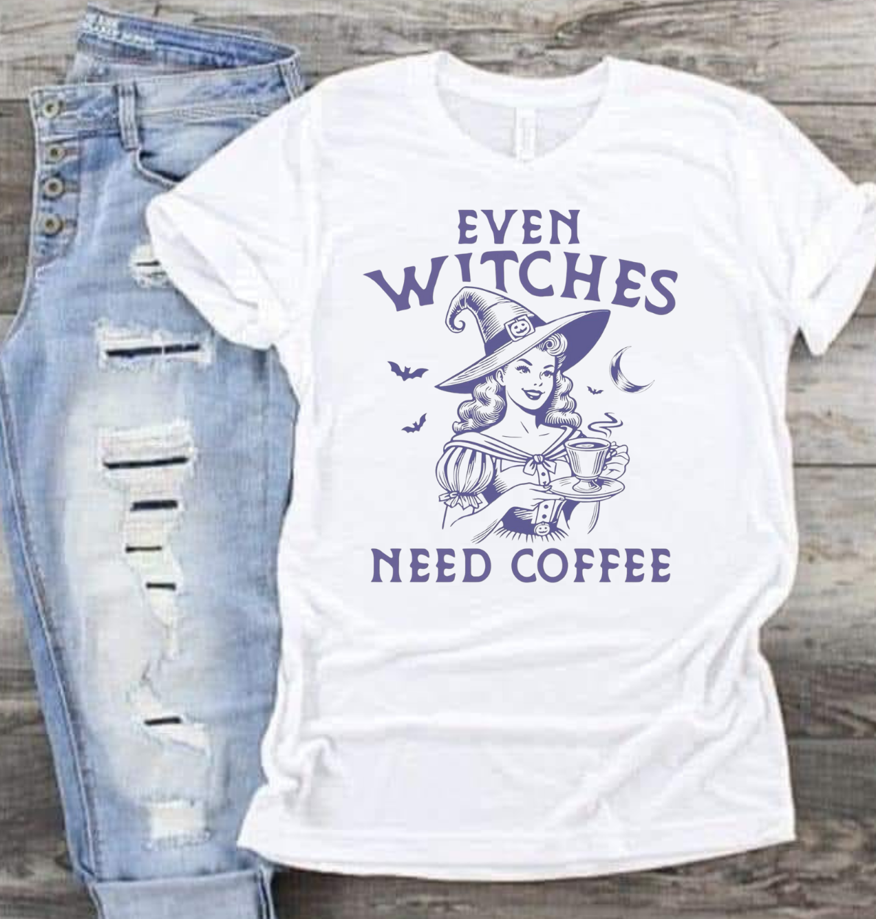 Witch-themed coffee shirt with text "Even Witches Need Coffee" in playful design.