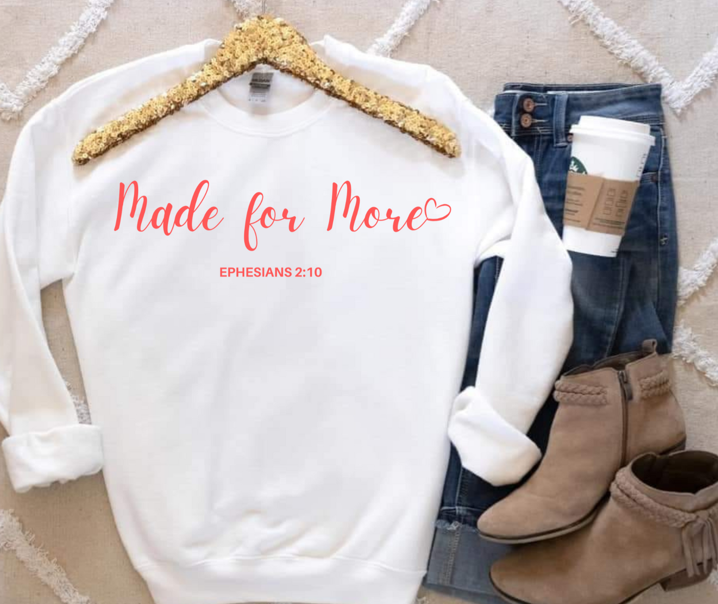 White "Made for More" sweatshirt by Gildan, styled with jeans and boots.