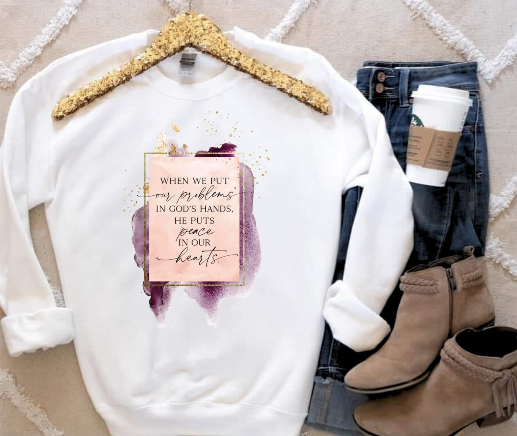 Gildan sweatshirt with "When We Put Our Problems in God's Hands" design, displayed with jeans and boots.