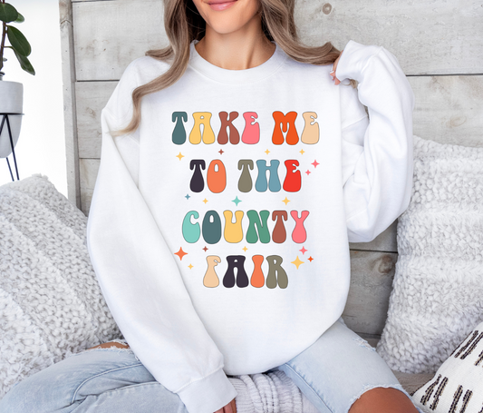 Take Me To The County Fair t-shirt with colorful letters, perfect for casual or fair-themed events.