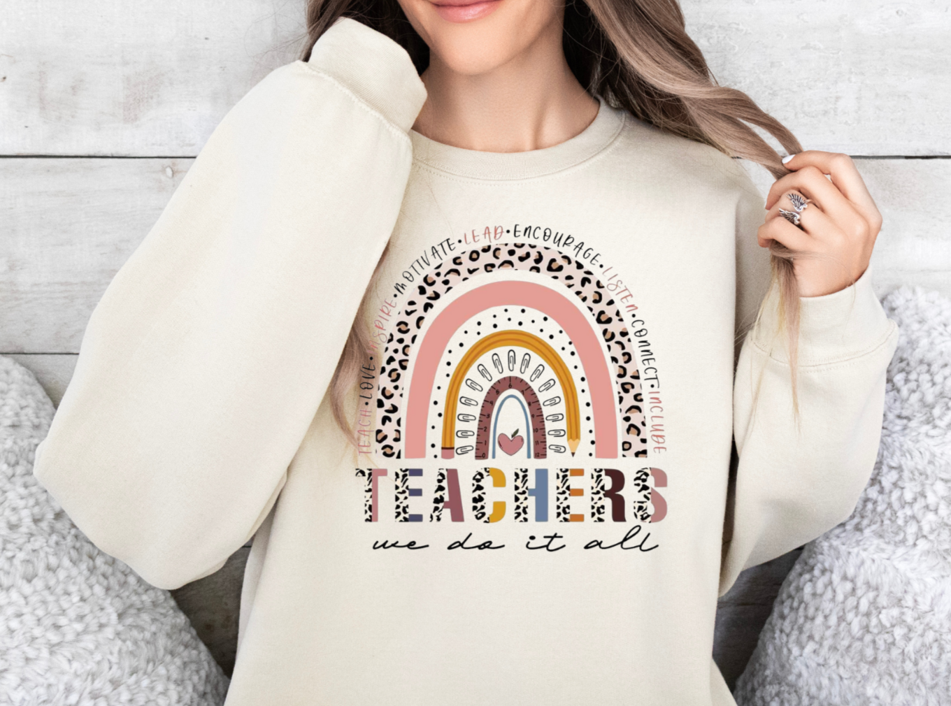 Gildan sweatshirt featuring "Teachers We Do It All" text design.