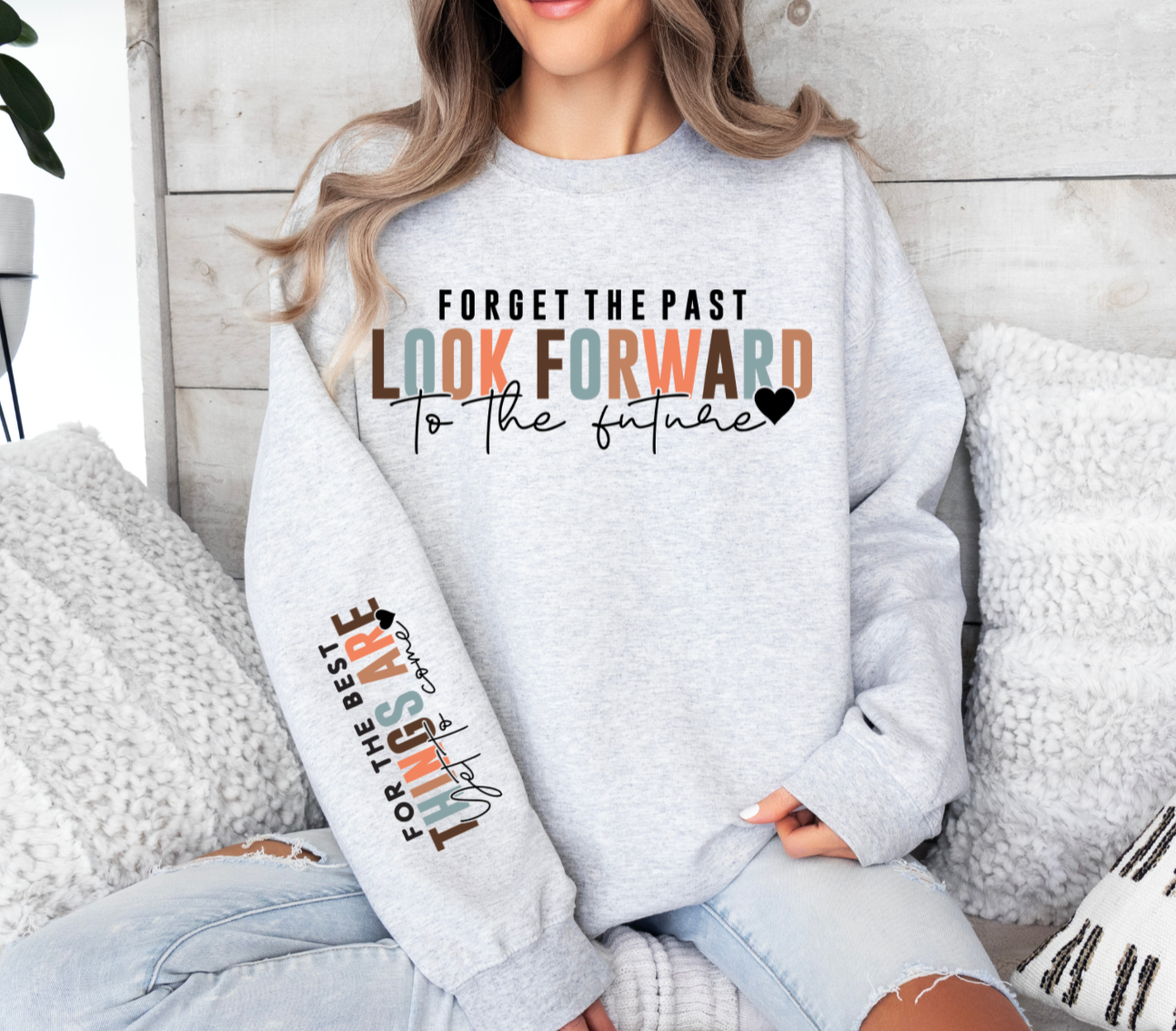 Gildan sweatshirt with motivational quote about looking forward to the future.