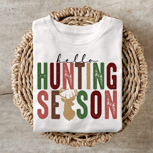 Hello Hunting Season shirt featuring colorful text and deer antler graphic, perfect for outdoor enthusiasts.
