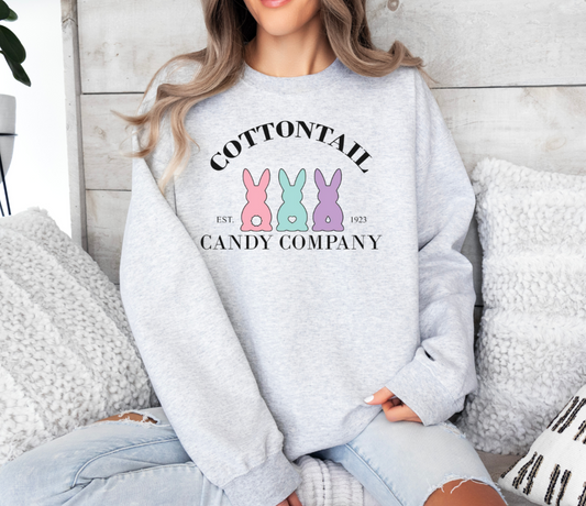 Cottontail Candy Company sweatshirt featuring pastel bunny design, worn by woman.