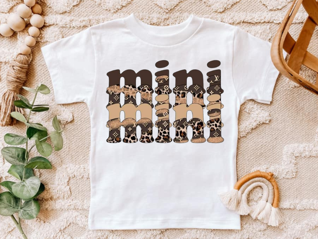 Infant and toddler shirt with "mini mini mini" design in neutral tones.