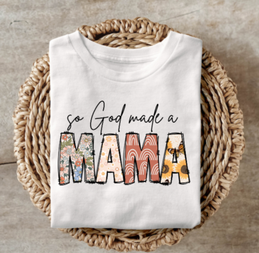 God Made a Mama t-shirt with floral and patterned letters, celebrating motherhood.