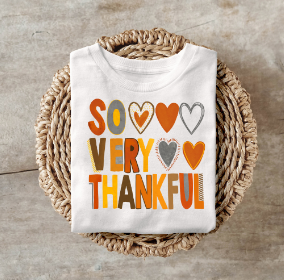 Thankful shirt with colorful hearts design, perfect for fall and Thanksgiving.