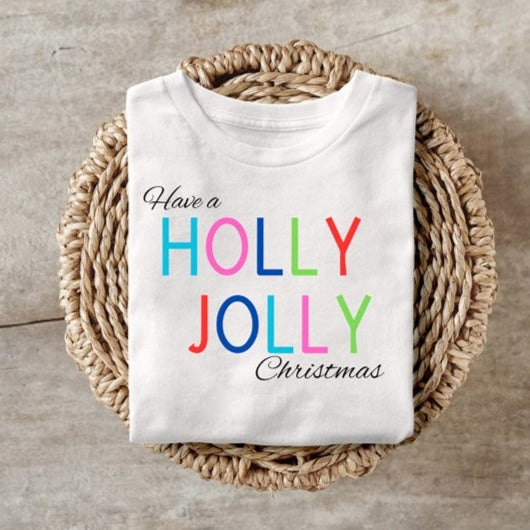Holly Jolly Christmas festive shirt folded neatly in a basket.