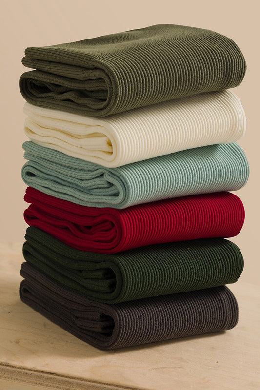 Seamless ribbed high waist biker shorts stack in various colors.