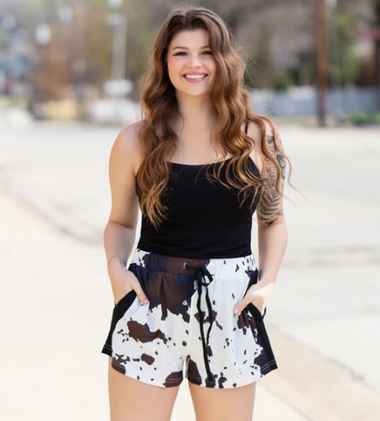 Cow Print Drawstring Shorts with Pockets for a stylish and practical look.