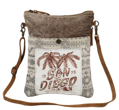 MYRA-San Diego Print small cross-body bag with canvas, leather, and hairon material.