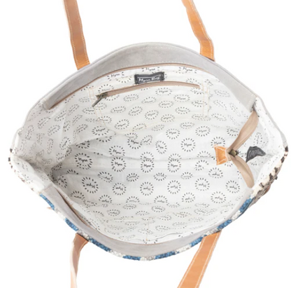 Interior view of MYRA Rhombic Pattern Tote Bag with leather handles, cotton lining, and interior pocket.