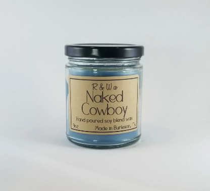 R&W Co. Naked Cowboy scented candle with soy blend wax in a glass jar.