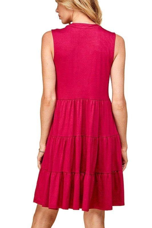 Solid sleeveless tiered dress with front lace design, perfect for any occasion.
