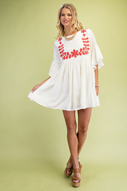 Coral Babydoll Mini Dress with delicate embroidery, perfect for any occasion.
