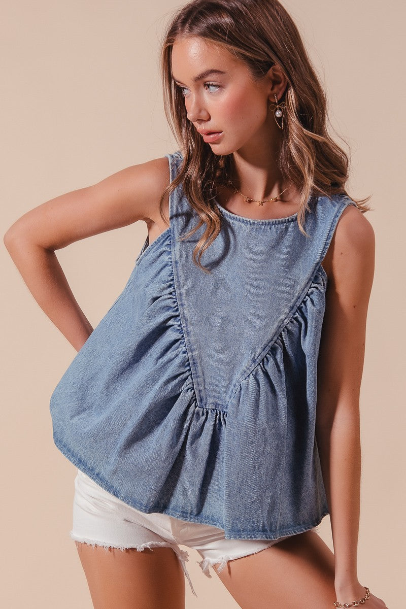 Denim rouched sleeveless top with playful rouching for a stylish summer look.