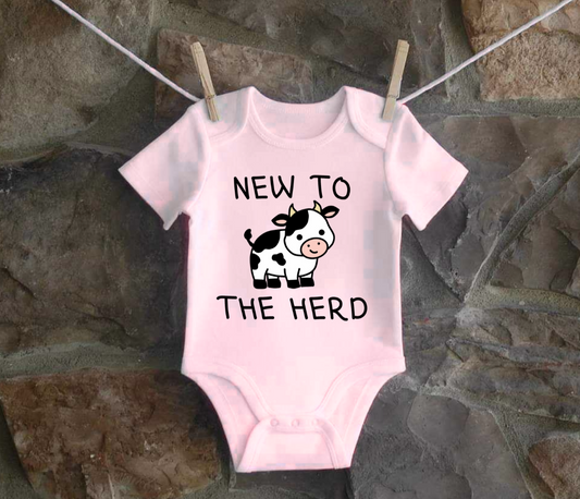 Infant and toddler shirt with cow graphic and "New to the Herd" text.