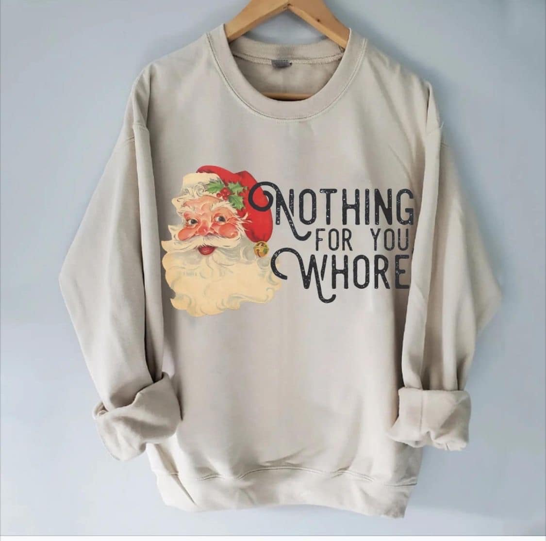 Holiday statement shirt featuring Santa Claus with "Nothing For You Wh*re" text.