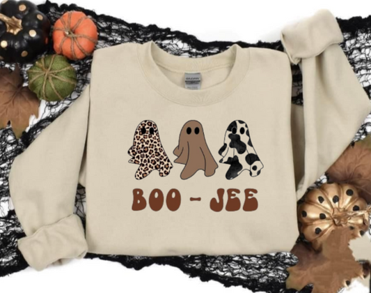 Boo-Jee Halloween shirt with playful ghost designs on a beige background.