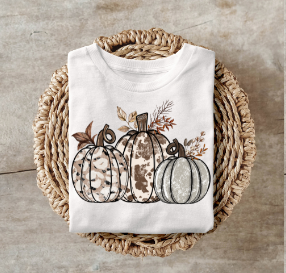 Cow Print Pumpkins shirt with playful fall design featuring cow-patterned pumpkins.