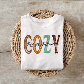 Cozy Season Shirt folded on woven tray.