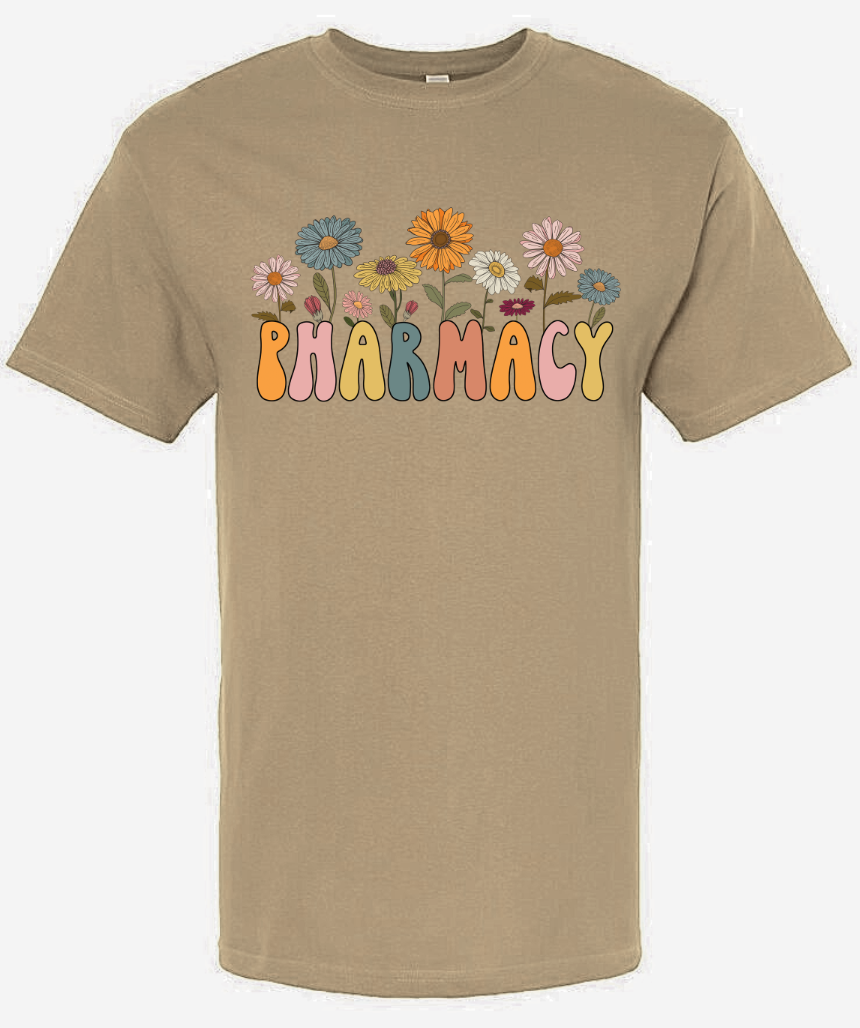 Retro Pharmacy Shirt with colorful flower designs on beige background.