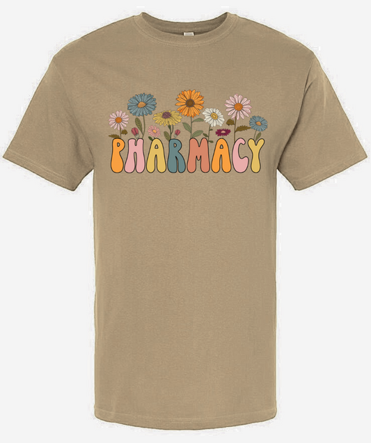 Retro Pharmacy Shirt with colorful flower designs on beige background.