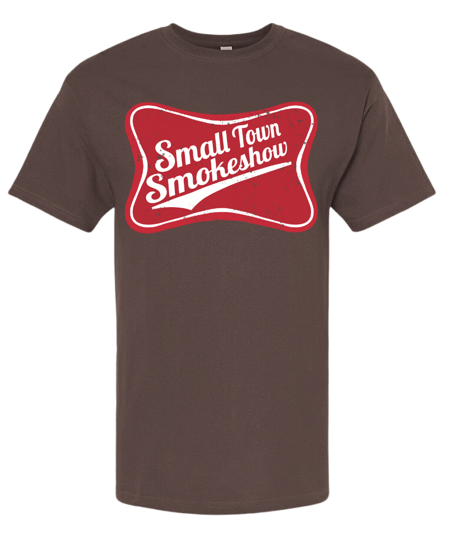 Small Town Smokeshow shirt with playful design on brown fabric.