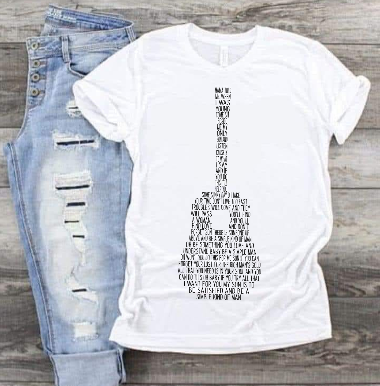 Simple Man shirt with guitar graphic and text design, paired with ripped jeans.