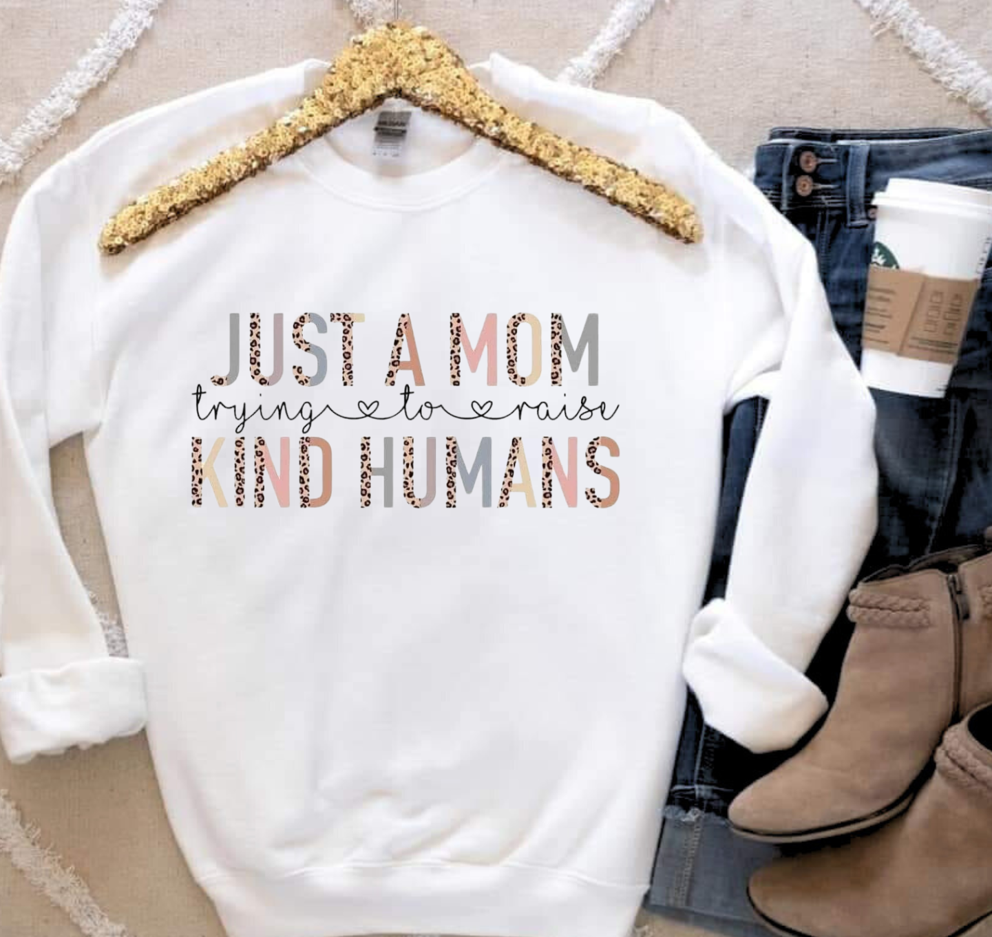 Mom Raising Kind Humans t-shirt promoting compassion and positivity.