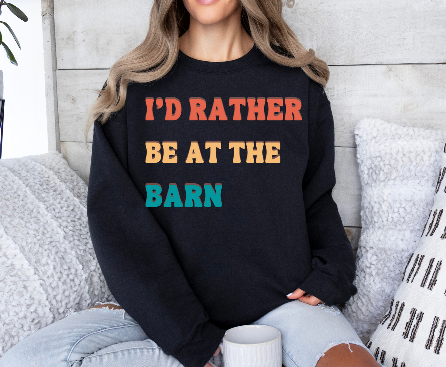 T-shirt with "I'd Rather Be At The Barn" printed, worn by a seated person holding a mug.