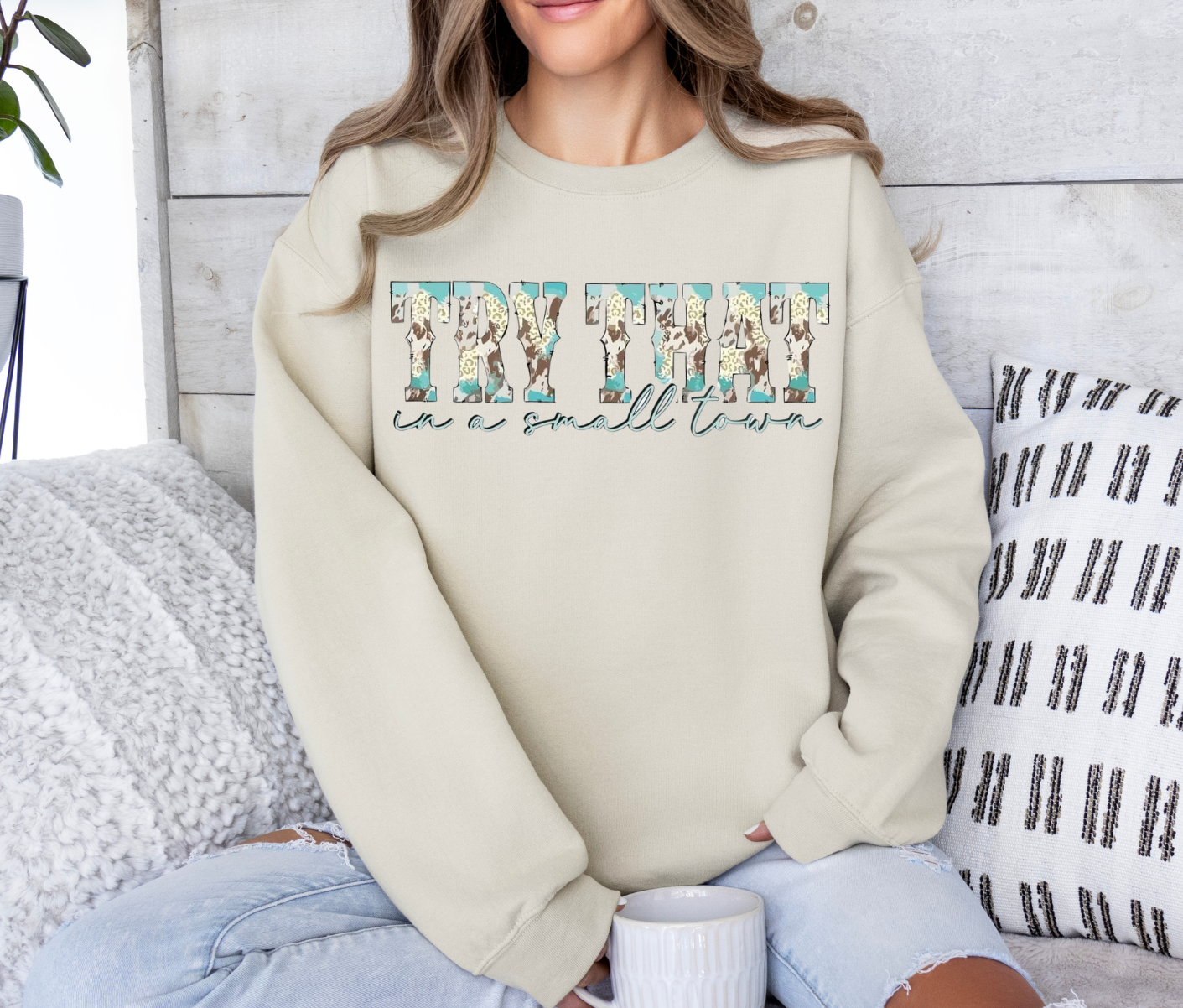 Sweatshirt featuring "Try That in a Small Town" design with cowboy theme.