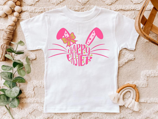Happy Easter pink shirt with bunny ears design on a white background.