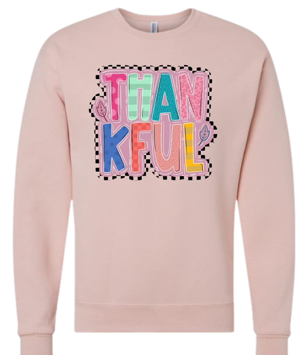 Thankful Shirt with colorful letters on a light pink sweatshirt.