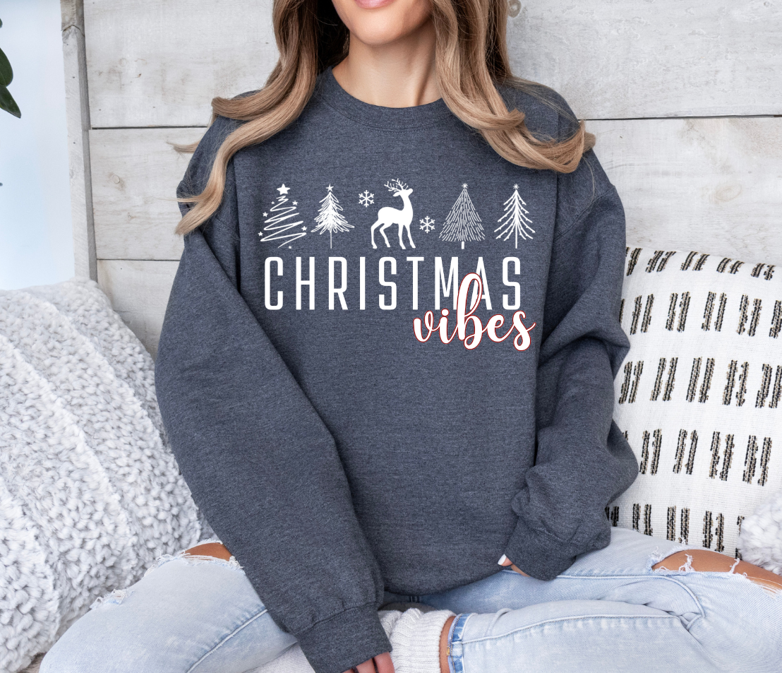 Christmas Vibes shirt with festive trees and deer design.