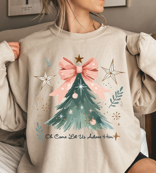 Christmas Tree shirt with pink bow and festive design, featuring the phrase "Oh Come Let Us Adore Him."